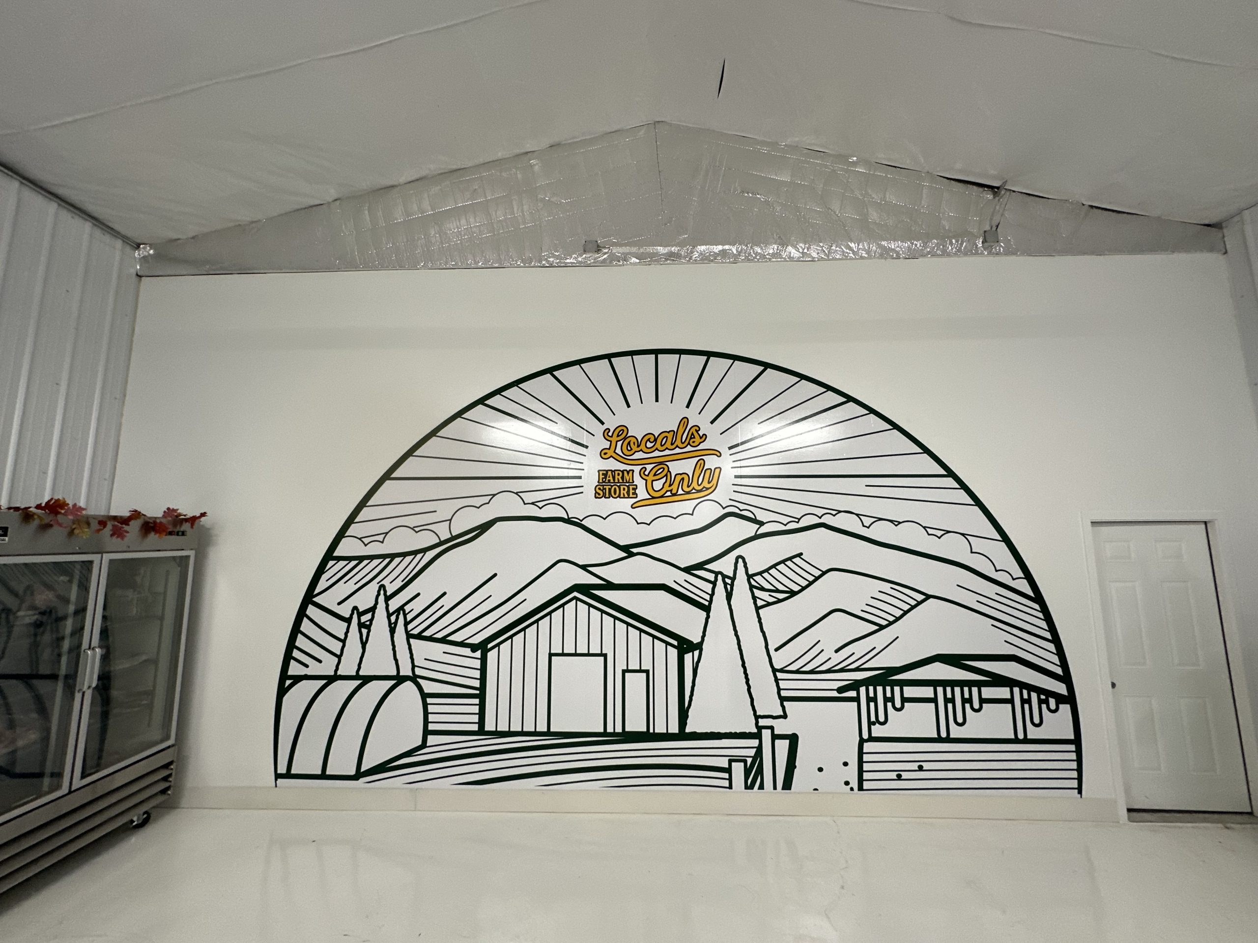 Interior wall mural and indoor signage for a retail store